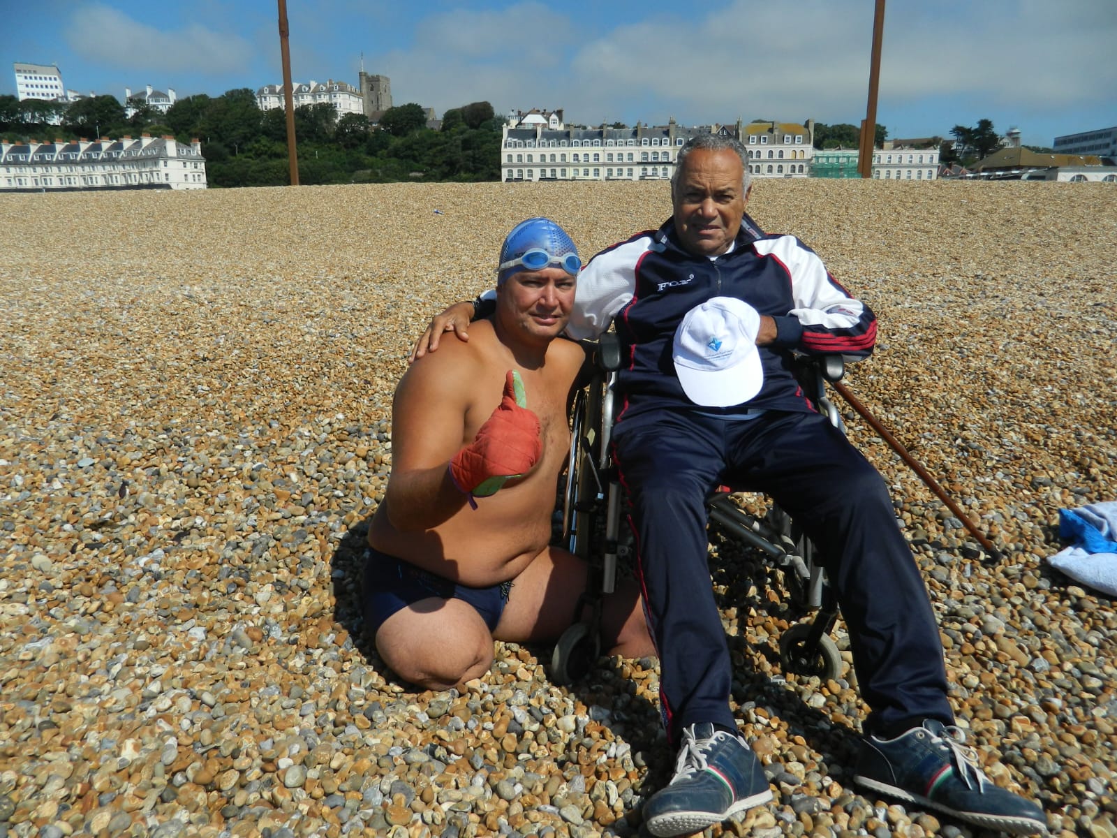 Ahmed Nasef with a team member on a shingle beach